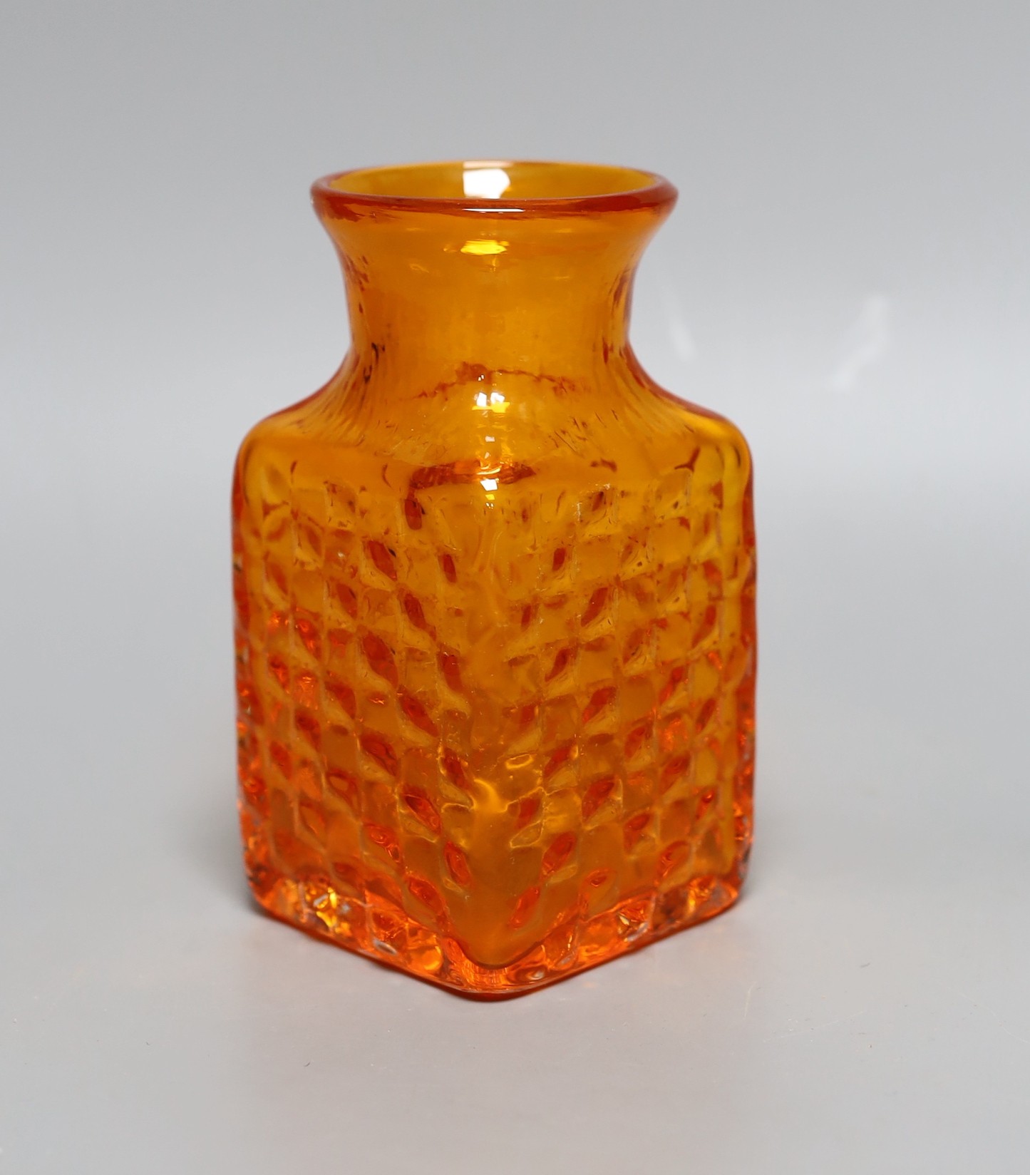 A Whitefriars 'Chess' glass vase, designed by Geoffrey Baxter, pattern number 9817, tangerine glass, 15cm tall